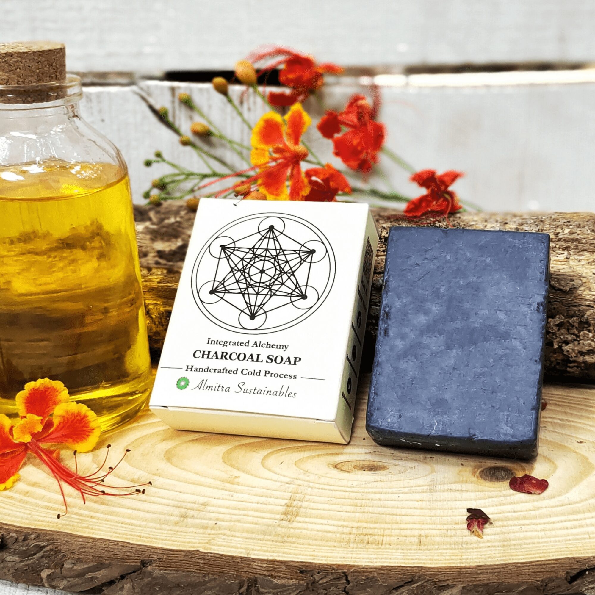 A rectangular bar of handmade charcoal cold process soap by Almitra Sustainables, resting on natural jute fabric with earthy and wooden elements in the background. This natural, plastic-free, vegan soap bar is crafted for deep skin detox and eco-conscious skincare routines.