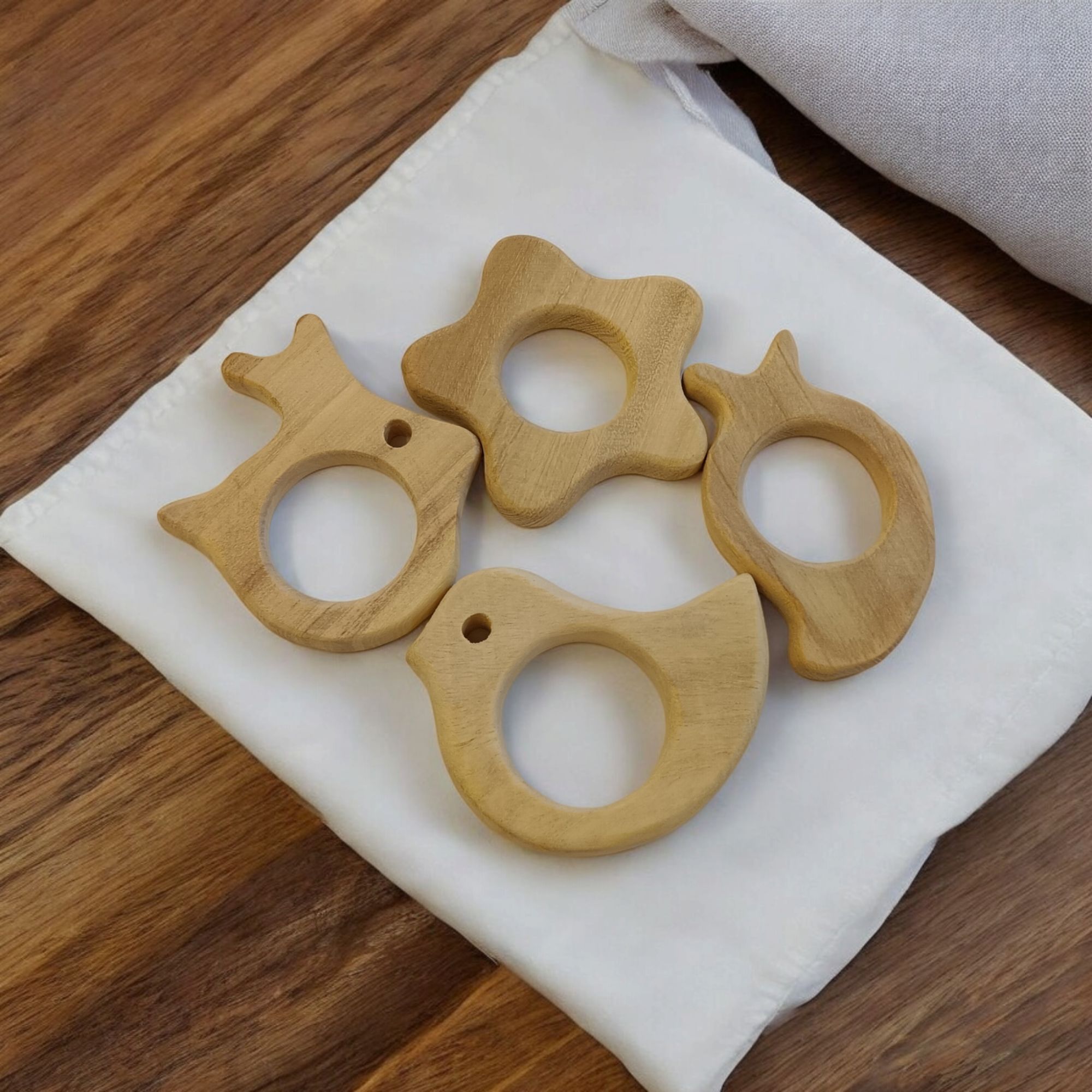 Pack of 4 Neem Wooden Teethers- Rabbit, Flower, Dove & Mango Shapes