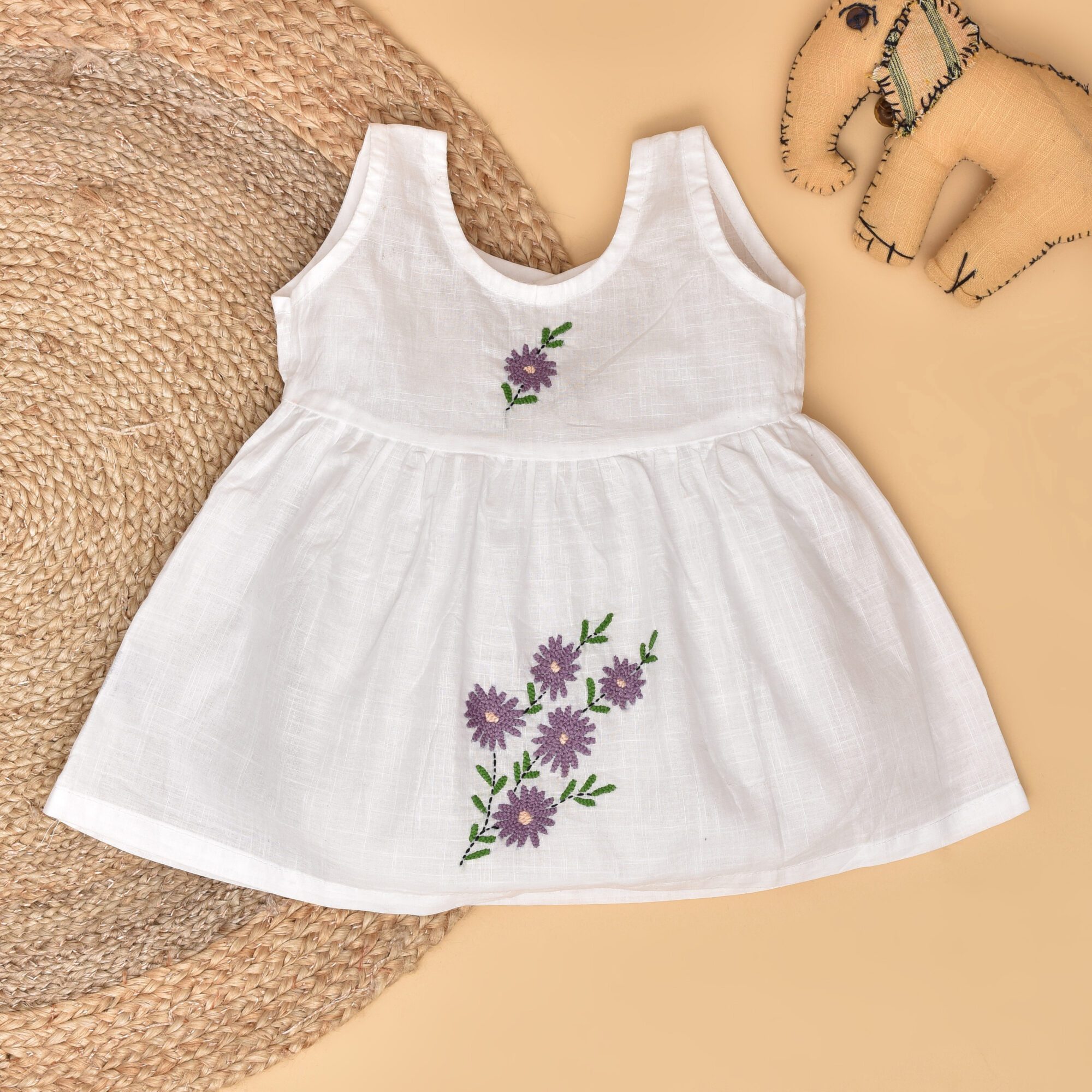 White Cotton Baby Dress with Lavendar Design Hand Embroidery