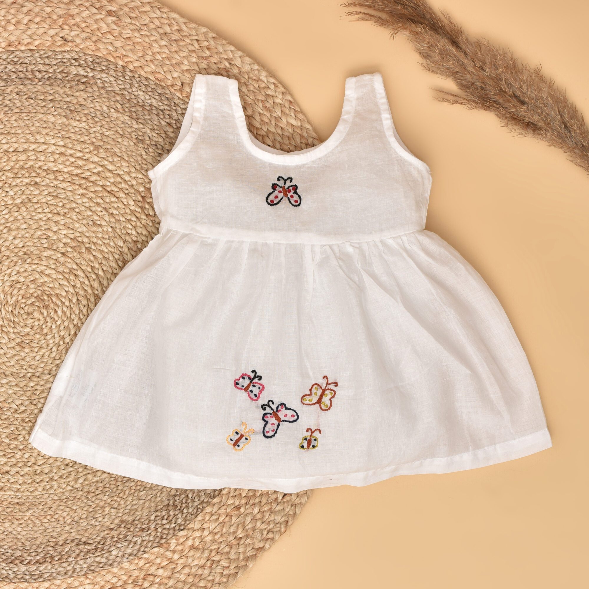 White Mulmul Baby Dress with Butterfly Design Hand Embroidery